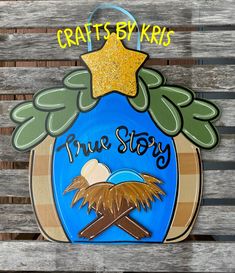 a wooden sign that says, crafts by kris true story with a nativity scene