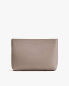 Rectangular leather pouch. Modern Rectangular Pouch For On-the-go, On-the-go Rectangular Soft Leather Clutch, Chic Clutch Pouch For On-the-go, On-the-go Laptop Sleeve Pouch Bag, Elegant Cosmetic Bag With Zipper For On-the-go, Modern Taupe Bag For Everyday Use, Versatile Leather Cosmetic Bag, Versatile Leather Cosmetic Bag For Daily Use, Versatile Everyday Bag With Laptop Sleeve