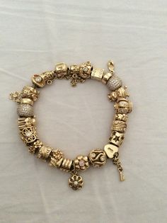 Gold Pandora Bracelet, Gold Pandora, Pandora Bracelet Charms Ideas, Pandora Bracelet Designs, Dope Jewelry Accessories, Pandora Jewelry Charms, Pandora Gold, The Bling Ring