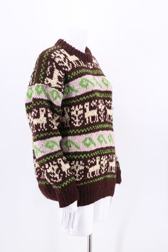 Handknit sweater in brown, cream and green. Wool knit with cute Llamas. Looks best worn a bit oversized. Heavy wool, very warm ! * No tags or labels * Handmade * 100% wool * Excellent condition * Dry Clean * Peru *Dimensions* * Size M : Bust= 42 Length= 27 Sleeve= 23 ALL SALES FINAL Retro Brown Knitted Sweater, Brown Nordic Sweater With Crew Neck, Brown Crew Neck Knitted Sweater, Cozy Brown Sweater With Fair Isle Pattern, Brown Alpaca Crew Neck Sweater, Brown Wool Sweater With Knitting Details, Cute Llamas, Heavy Knit Sweater, Llama Print