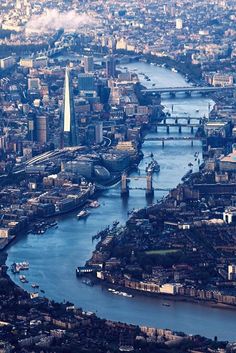 an aerial view of the city and river in london, england taken from the air