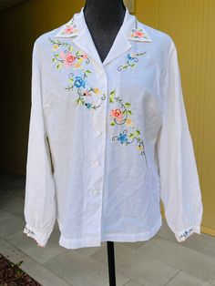 Fitted Long Sleeve Shirt With Embroidered Cuffs, Long Sleeve Embroidered Top For Spring Daywear, Spring Long Sleeve Embroidered Top, Spring Long Sleeve Top With Embroidered Cuffs, White Long Sleeve Shirt With Machine Embroidery, Fitted Long Sleeve Blouse With Embroidered Cuffs, Floral Embroidery Long Sleeve Blouse For Daywear, Long Sleeve Blouse With Floral Embroidery For Daywear, Spring Daywear Blouse With Embroidered Cuffs