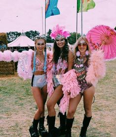 two women in pink and black outfits standing next to each other