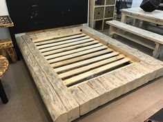 a bed frame made out of wooden planks