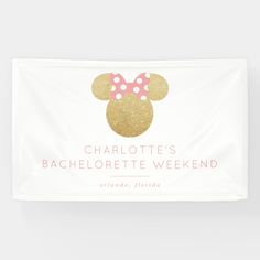 a white banner with pink and gold minnie mouse ears on it's side that says charlotte's bachelor weekend