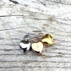 "The perfect gift for anyone needing to keep a loved one close at heart. We offer hearts in Stainless Steel, 24K Rose Gold plated over SS, as well as 24K gold plated over SS. These pieces will never rust or tarnish. Choose from pendant alone or strung on a coordinating chain-- we can also add an initial on back! This simple urn pendant is just 7/16\" across (under half an inch). If elected, I can include a dainty, but sturdy matching 18\" chain ... (if you need your chain cut shorter, just leave Nickel Free Heart Charms For Anniversary, Heart Charm Necklace For Keepsake, Heart Charm Necklaces For Anniversary Gift, Charm Necklaces With Heart Charm For Anniversary, Keepsake Heart Charm Pendant Necklace, Heart Charm Round Pendant Necklace As Anniversary Gift, Heart Charm Round Pendant Necklace For Anniversary, Keepsake Open Heart Charm Necklace, Double Heart Charm For Gifts