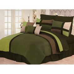 a bed with green and brown comforters in a room