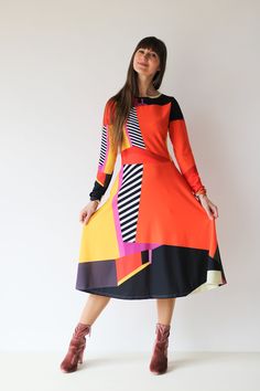 AMBER midi DRESS  The original abstract print design on the dress is created by a professional artist. Colourful abstract print dress with geometrical elements, with long sleeves. Be unique. Be outstanding. Be authentic. Bright and lively colors have the power to uplift mood and instill a sense of joy. Wearing a vibrant color dress can evoke feelings of happiness and positivity, brightening not only the wearer's day but also those around her. The dress showcases an original abstract print design Patterned Midi Dress For Party, Chic Multicolor A-line Midi Dress, Chic Long Sleeve Graphic Print Dresses, Patterned Long Sleeve Dress With Graphic Print, Chic Long Sleeve Dresses With Graphic Print, Multicolor A-line Maxi Dress For Fall, Long Sleeve Multicolor Abstract Print Dress, Spring Midi Dress With Bold Print, Multicolor Abstract Print Long Sleeve Dress