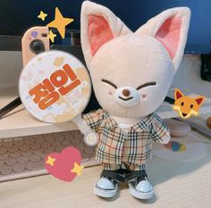 a small stuffed animal is sitting on a desk