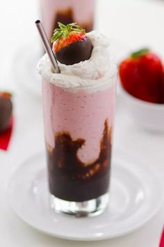 two desserts with strawberries and chocolate on top