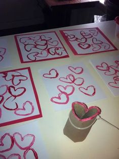 valentine's day crafts made with toilet paper and glue on a table top in the shape of hearts