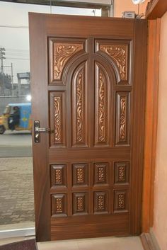 a wooden door with intricate carvings on it