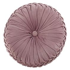 a round cushion with pleated fabric on the top and bottom, in light pink