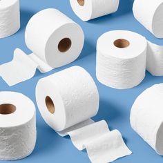 several rolls of toilet paper on a blue background