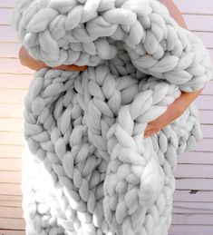 there is a large chunky blanket wrapped in yarn