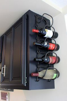 a wall mounted wine rack holding several bottles