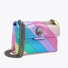 The Leather Mini Kensington Purse is crafted from a pastel metallic laminated pebble grain cow leather in the iconic diagonal rainbow sewn stripe pattern. The antiqued silver Eagle head features opaque silver crystals and black bead eyes on the front flap.5.5in (H), 7.9in (L), 2.4in (D)Strap drop cross body: 47.2inStrap drop shoulder: 30.3inAntiqued silver chain strapDuo magnetic snap closure hidden under flapSilver foil embossed logo on the backCan fit phones up to 7 inchesSmall internal lining Silver Eagle, Leather Cross Body Bag, Girly Accessories, Eagle Head, Luxury Purses, Fancy Bags