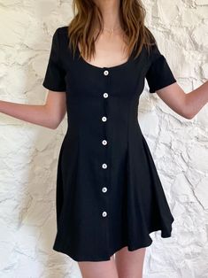 A cute and flouncy fit and flare dress! Button down in mother of pearl. This one is a thicker, slightly stretchy black rayon. All our fabrics are upcycled deadstock. Dry clean only. Black Flowy Dress, Kibbe Romantic, A Line Mini Dress, The Flare, Dry Clean Only, Flowy Dress, Fit Check, Character Outfits, Babydoll Dress