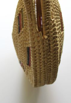 Here we have a cute Vintage Large Round Straw Raffia Tote Handbag from the 1970s. It has two straw handles and it is made of woven raffia. It has green, red and yellow raffia accents. The bag measures 14 inches in diameter, 17 inches tall including the handle and 2 1/2 inches thick around the edges. It is in fantastic shape minus some wear on the bottom. This awesome purse would make a great addition to any outfit! Vintage Woven Crochet Bag In Natural Color, Red Bohemian Straw Bag Rectangular, Red Bohemian Rectangular Straw Bag, Bohemian Red Rectangular Straw Bag, Vintage Red Shoulder Bag For Summer, Vintage Brown Woven Straw Bag, Red Woven Beach Bag In Basket Shape, Handmade Vintage Straw Basket Bag, Vintage Handwoven Beige Straw Bag