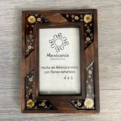 a wooden frame with flowers on it