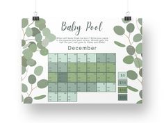 a baby pot calendar with green leaves on it