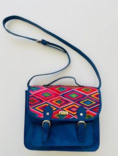 High quality colorful leather embroidered crossbody bag. This is a one of a kind purse that complements any outfit. Wear it for daily use or dress it up. Length: 10 3/4 inches Width: 3 inches Height: 9 inches Strap: Adjustable Visit us at Omxboutique on Instagram Artisan Crossbody Satchel With Adjustable Strap, Multicolor Embroidered Shoulder Satchel For Daily Use, Everyday Rectangular Satchel With Multicolor Embroidery, Artisan Satchel With Adjustable Strap Crossbody, Multicolor Embroidered Satchel For Daily Use, Traditional Crossbody Satchel For Everyday Use, Multicolor Embroidered Shoulder Bag With Adjustable Strap For Everyday, Multicolor Embroidered Satchel Shoulder Bag For Daily Use, Everyday Multicolor Embroidered Rectangular Satchel