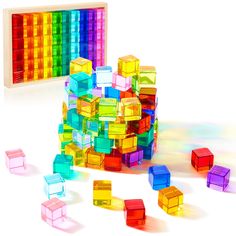 PRICES MAY VARY. What You Will Get: you will receive 60 pieces of rainbow crystal cubes, and they are packed in a safe solid wood storage box; Our rainbow crystal cubes are available in 10 colors, very beautiful and charming, and they will sparkle under the sun and show different colors reflection Beautiful Teaching Aids and Toys: rainbow acrylic cubes are in bright and vibrant colors; When exposed to light, they glow brilliantly, creating a brilliant visual effect; When paired with a light tabl Candy Cube Table, Colored Cube Storage, Colored Storage Cubes, Rainbow Attachment Storage, Number Blocks Gifts, Rubix Cube Storage, Lite Brite Storage, Epoxy Resin Toys, Target Hashtag Building Blocks