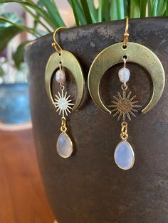 Handmade sun and moonstone earrings. ✨Made with love and intention✨ Hypoallergenic 18k gold plated sterling silver. FOLLOW: Insta: @alchemistreasure ✨P R O D U C T I O N - T I M E ✨ Each pair of my lovingly handcrafted earrings is naturally one of a kind and hand made to order. Please allow 2-4 business days for production. If you have a specific deadline, please let me know and I will do my best to accommodate you! ✨N A T U R A L - V A R I A T I O N ✨ Please note, these stones are real, raw, an Gold Crescent Spiritual Earrings, Gold Symbolic Moon Charm Earrings, Gold Celestial Nickel-free Earrings, Nickel-free Gold Celestial Earrings, Gold Symbolic Earrings With Moon Charm, Gold Moonstone Jewelry With Moon Phase, Celestial Brass Jewelry For Anniversary, Symbolic Gold Earrings With Moon Charm, Everyday Hypoallergenic Moon-shaped Jewelry