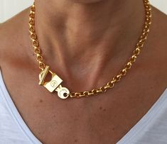 Gold plated 24K chunky necklace, Key and lock necklace, Chunky rolo chain, Padlock necklace This necklace is made with 24K gold plated brass rolo chain and gold plated zamak key and lock toggle. Rolo chain link: 6.3x2.5mm Key and lock toggle: 36x17mm Zamak is a great alternative to solid sterling silver for the budget conscious buyer, it is just as pretty and durable and it is stain less. All silver pieces are subjected to an anti-allergic process ( nickel and lead free). All our designs are han Leather Silver Bracelet, Chunky Gold Bracelet, Key And Lock, Lucky Charm Bracelet, Horse Bracelet, Padlock Necklace, Pave Necklace, Necklace Charms, Lock Necklace