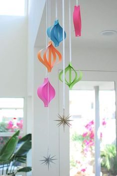 colorful paper ornaments hanging from the ceiling