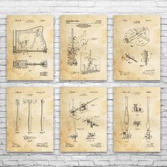 four drawings of different machines and tools on parchment paper, against a brick wall with white bricks