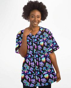 Discover the magic of our Shroomin Black Baseball Jersey, a unique and eye-catching addition to your wardrobe. This black jersey features a stunning all-over mushroom print, adding a vibrant pop of color to your jersey collection. Made with moisture-wicking fabric, it offers a lightweight and breathable feel for ultimate comfort. Plus, our high-definition printing ensures that the captivating design won't fade after washing. Get ready to stand out with this one-of-a-kind baseball jersey. 100% po Black Crew Neck Top With Rainbow Print, Black Crew Neck Top With Mushroom Print, Black Short Sleeve Top With Mushroom Print, Forest Clothes, Jersey Collection, Mushroom Print, Rave Outfit, Mini Hands, Daisy Earrings