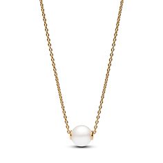 Elevate your style with our Treated Freshwater Cultured Pearl Collier Necklace from our Pandora Timeless collection. This 14k gold-plated piece features an adjustable cable chain with a luminous treated freshwater cultured pearl pendant. A clear cubic zirconia by the clasp adds a touch of sparkle. This necklace represents the fusion of classic and contemporary, making it a perfect choice for both casual and special occasions. Please note that each treated freshwater cultured pearl is unique and can vary in size and colour; normal wear and tear may occur with this material. Our freshwater cultured pearls are treated with bleaching and lustre enhancement. Pandora Pearl, Engagement Rings Bridal Sets, Pandora Style, Bridal Ring Sets, Freshwater Cultured Pearls, Anniversary Bands, Metal Necklaces, Perfect Gift For Her, Pandora Jewelry