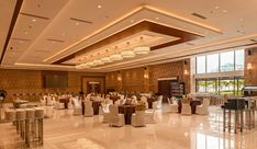 a banquet hall with tables and chairs set up