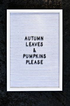 the words autumn leaves and pumpkins please are written on a white frame against a black background