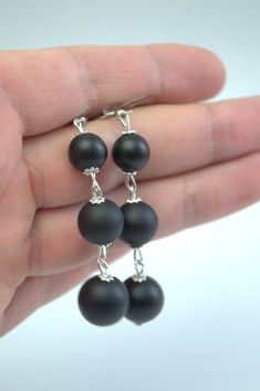 Simple and Elegant black Onyx drop earrings Elegant earrings made of high quality natural matt black onyx - simple and beautiful. This earrings is a good accessory for work or everyday use. Dress these up or down; a great basic. Most of my jewelry can easily be resized at no additional charge. I would love to assist you with your custom order, so please do not hesitate to contact with me. All my earrings is made with care and handmade. Earrings details: Length: Long dangle earrings measure 55 mm Minimalist Matte Black Jewelry For Gifts, Minimalist Matte Black Jewelry Gift, Black Minimalist Earrings For Jewelry Making, Minimalist Black Dangle Jewelry, Minimalist Black Long Drop Earrings, Nickel-free Black Long Drop Jewelry, Black Wire Wrapped Drop Earrings, Artisan Black Dangle Earrings, Onyx Dangle Earrings For Gift