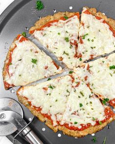 a pizza sitting on top of a pan covered in cheese