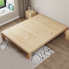 a wooden bed frame in a small room