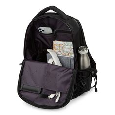 the back compartment of a backpack with various items in it, including a map and cell phone