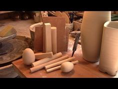 several different types of pottery sitting on a table