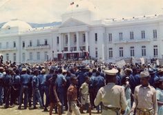 a large group of people standing in front of a building