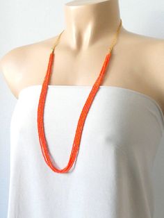 "Delicate and dainty long beaded orange necklace. It measures 30\". ❤ SHIPPING Please check shipping options and timeframe once you add item/s to the cart. In addition, you can click on the tab \"Shipping & Policies\" above for more information on processing time and cost. ❤ CUSTOM ORDERS If you like this item in a different color, send me a message indicating: color, size and quantity needed. I will send you a link for a \"custom order\" and you'll be able to place the order there. If you l Bohemian Orange Necklace For Wedding, Handmade Orange Beaded Necklace For Wedding, Orange Beaded Necklaces For Wedding, Orange Beaded Long Necklace For Gift, Orange Long Beaded Necklace For Gifts, Orange Long Beaded Necklace For Gift, Orange Beaded Necklace For Wedding, Elegant Orange Beaded Chain Necklace, Orange Multi-strand Beaded Necklaces