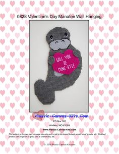 a knitted teddy bear holding a pink heart with the words valentine's day matee wall hanging