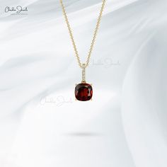 Description Featuring a charismatic 6MM cushion-shaped Garnet in a claw setting, this solitaire pendant with shimmering linear bale evokes enchanting charm, sculpted in 14k solid gold with January birthstone red-hued garnet and white 1MM round diamonds for the stunning style of purpose. The gold chain shown in pictures is just for reference and display purpose, in order pendant comes with a COMPLIMENTARY 925 SILVER CHAIN. Product Details SKU CJ-P-1162B-G Metal 14K solid gold Product dimension 12 Stunning Style, Claw Setting, Garnet Pendant, Diamond Bar, January Birthstone, Solitaire Pendant, Unique Pendant, Pure Gold, Red Garnet