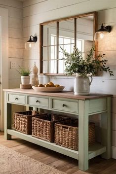 a green table with baskets under a mirror