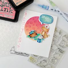 an assortment of crafting supplies including stamps, markers and stickers on a table