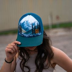 Take on the great outdoors in style with Misty Mountains Unisex Truckers. Featuring scenic mountains and a unisex fit, these truckers provide both comfort and adventure for all your outdoor expeditions. A Montana Scene Original Design. Printed in Montana. All designs are property of The Montana Scene. All rights reserved. Come visit our storefront locations! Bigfork * Whitefish * Missoula * Kalispell * Bozeman Scenic Mountains, Kids Onesies, Misty Mountains, Kids Beanies, Sock Gifts, Brand Ambassador, Kids Hats, Great Outdoors, Kid Tees