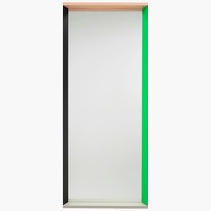 an empty green and black frame on a white wall