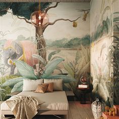 an elephant mural in the corner of a bedroom with a day bed and nightstands