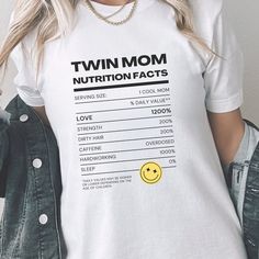 Twin Mom Nutrition Facts ABOUT THE SHIRT: This classic unisex jersey short sleeve tee fits like a well-loved favorite. Soft cotton and quality print these t-shirts have-ribbed knit collars to bolster shaping. The shoulders have taping for better fit over time. Dual side seams hold the garment's shape for longer. : 100% Airlume combed and ringspun cotton (fiber content may vary for different colors) .: Tear away label .: Runs true to size Twin mom t-shirt, twins t-shirt, twin mama tee, twin jokes Funny T-shirt With Text For Family, Family Funny Print Graphic Tee, Fun Family T-shirt With Funny Text, Funny Short Sleeve Tops For Mother's Day, Funny Text T-shirt For Mother's Day, Mother's Day Family T-shirt With Funny Text, Mother's Day Family T-shirt With Funny Print, Mother's Day Graphic Tee With Funny Text, Mother's Day Funny Text Graphic Tee